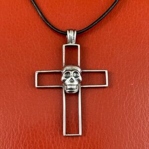 Sterling skull & cross pendant on a black leather necklace. Signed KC Sport 925.